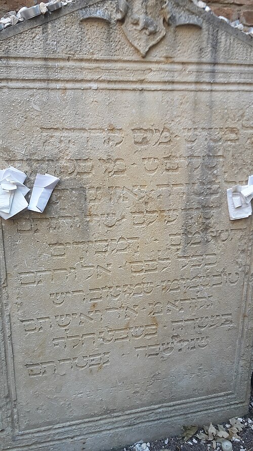 The gravestone of the Maharam of Padua, with prayer notes tucked in
